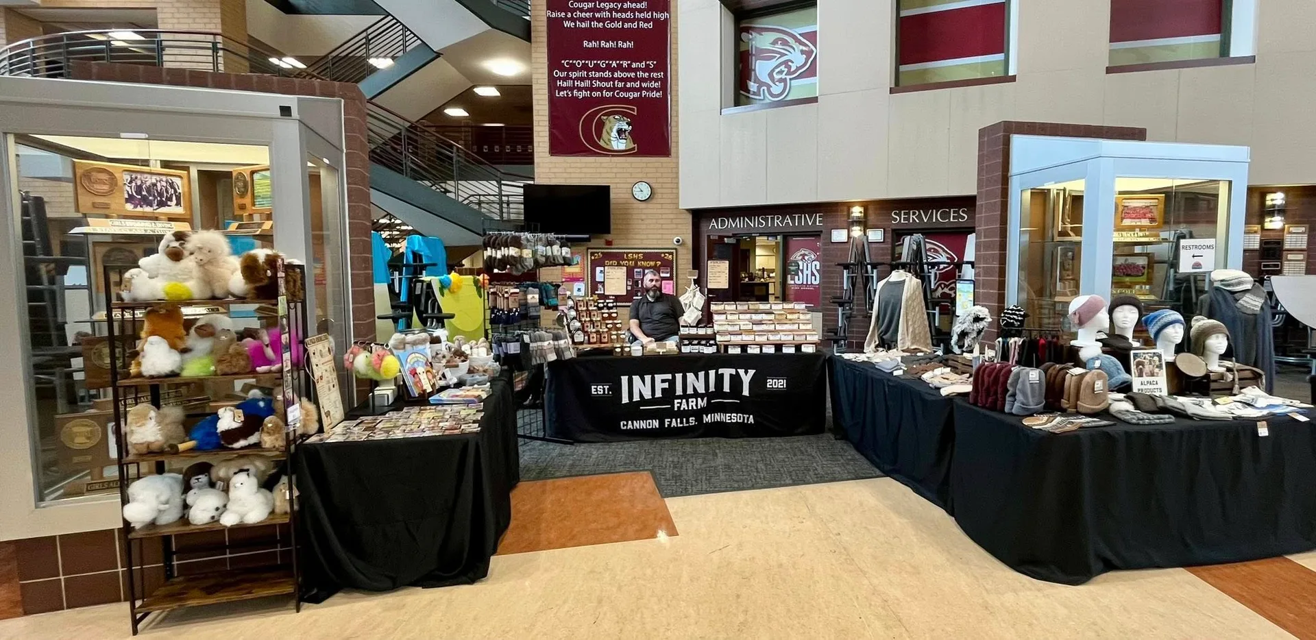 Infinity Farm booth displaying handmade products at a craft show